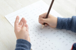 Educational concepts, boy studying hard on his desk